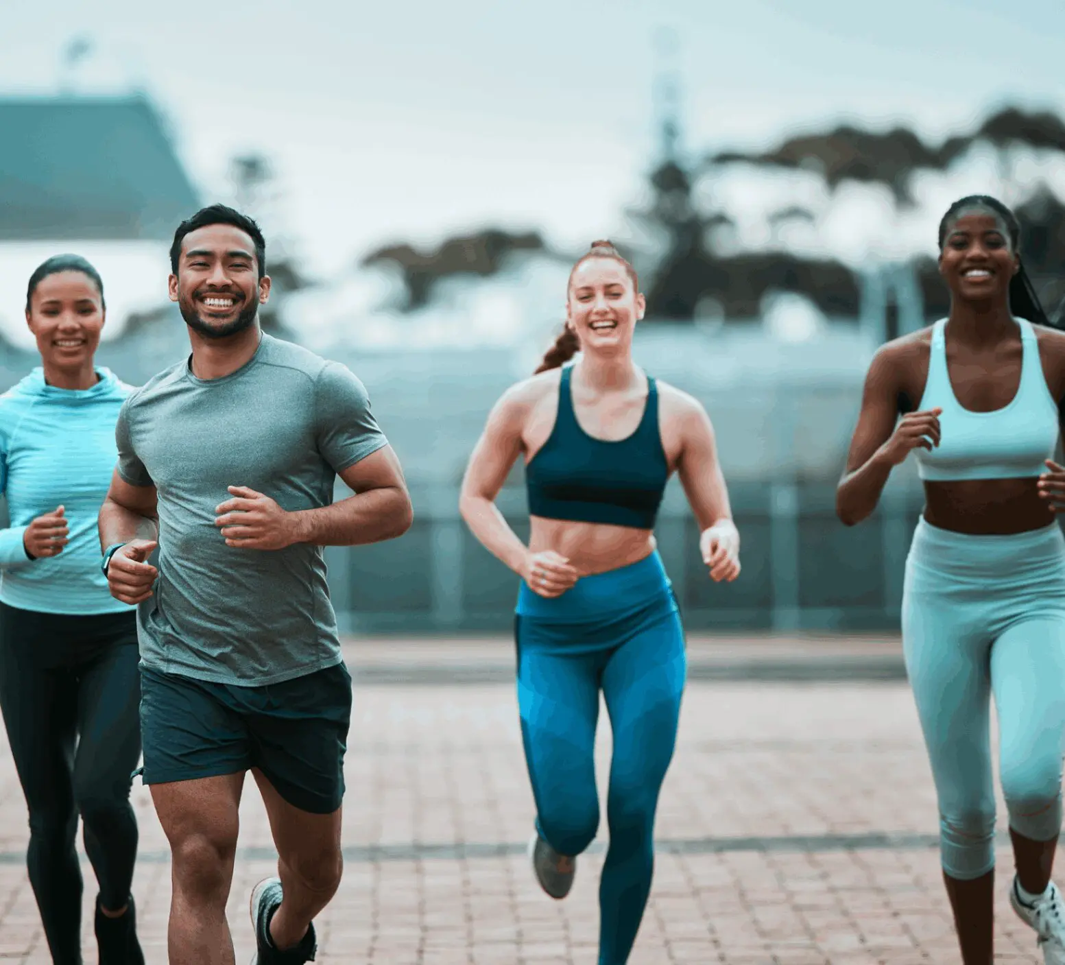 Group of people jogging outdoors together.